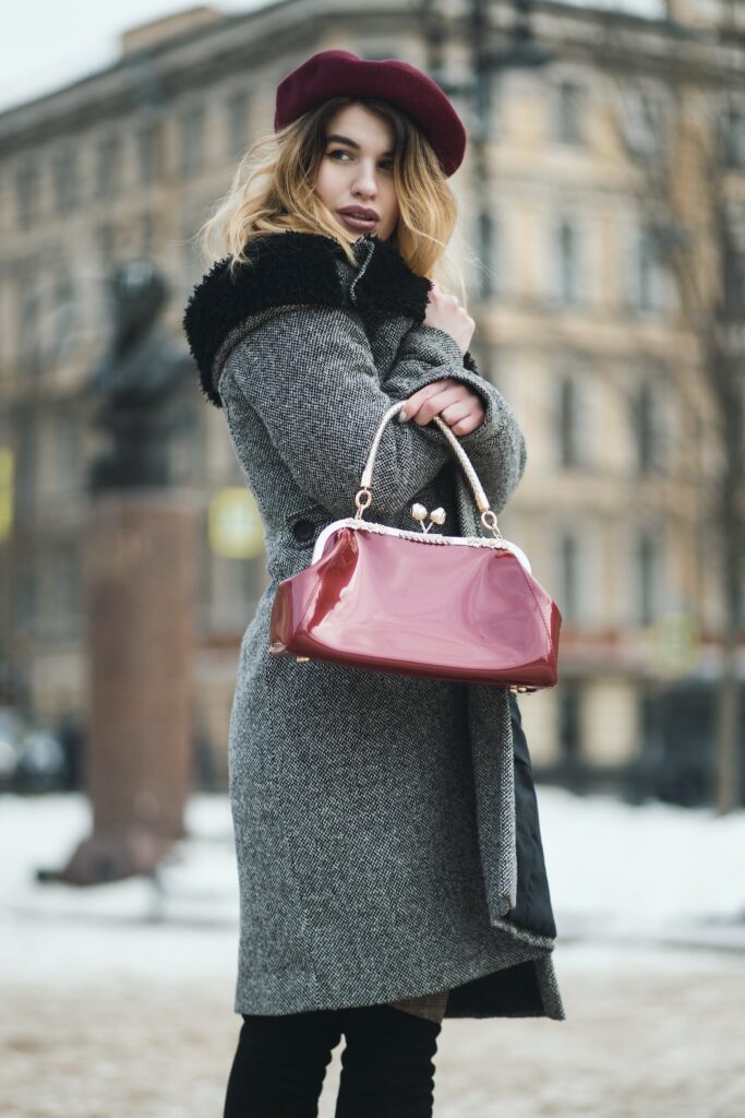 Selective Focus Photography Woman Wearing Gray Coat Standing Near Building